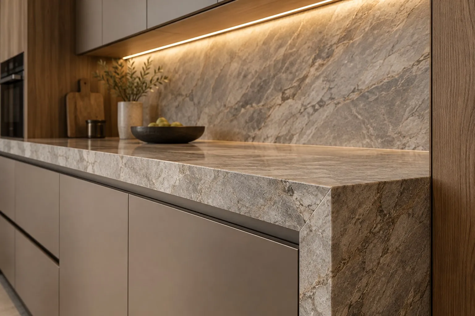 Mitred stone countertop edge with under-cabinet LED lighting on the backsplash